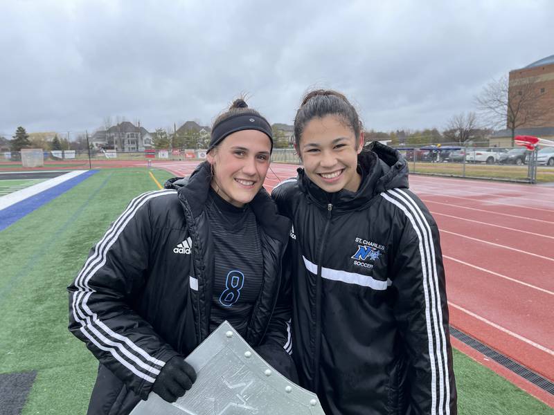 St. Charles North senior Sophia Hein (left) and sophomore Julianna Park after the North Stars’ 6-0 victory over Neuqua Valley on Saturday.