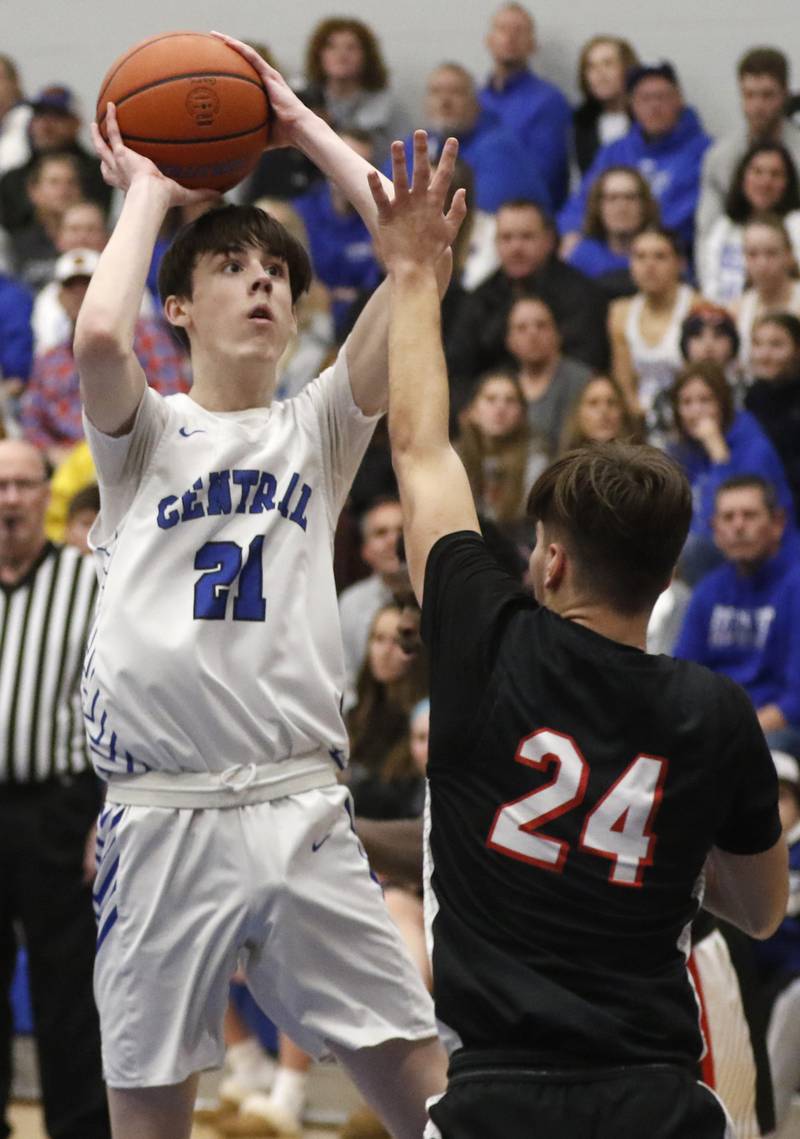 Burlington Central's Bennek Braden shoots the ball over Huntley's Ryan Sweeney during a Fox Valley Conference boys basketball game on Friday, Dec. 15, 2023, at Burlington Central High School.