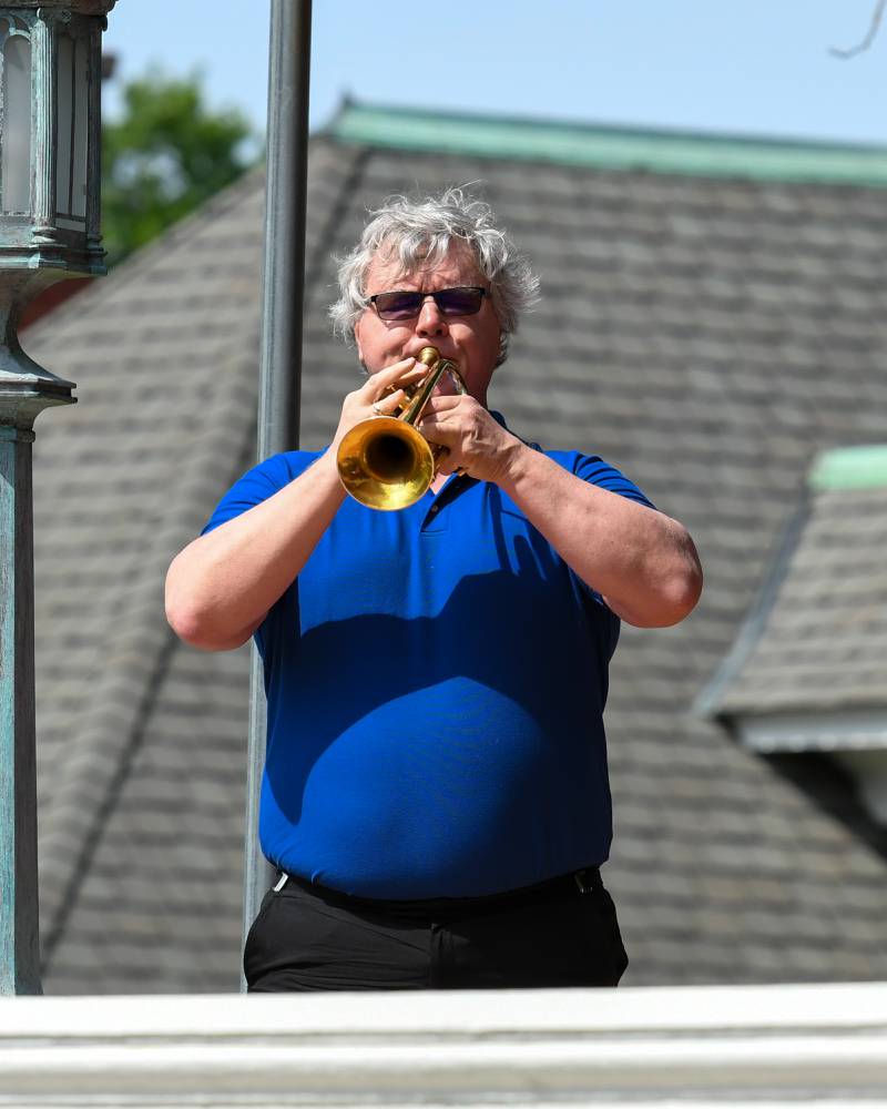 Mark Baldin plays Taps during the Memorial Day ceremony on Monday May 30th held on the Ellwood House lawn in DeKalb.