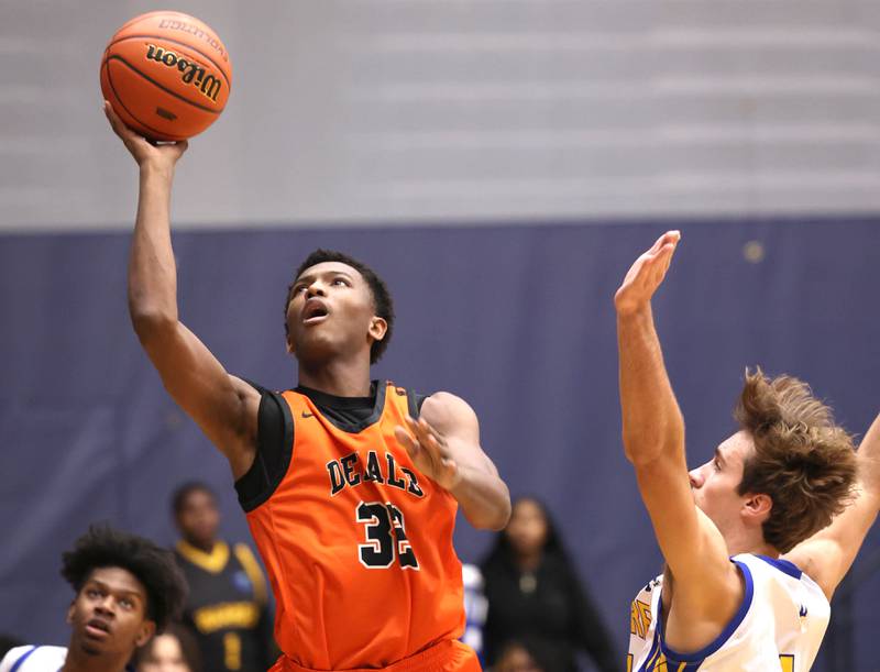 DeKalb’s Justin O’Neal gets a layup in front of Warren's Jack Wolf Tuesday, Feb. 27, 2024, during their Class 4A sectional semifinal game at Rock Valley College in Rockford.