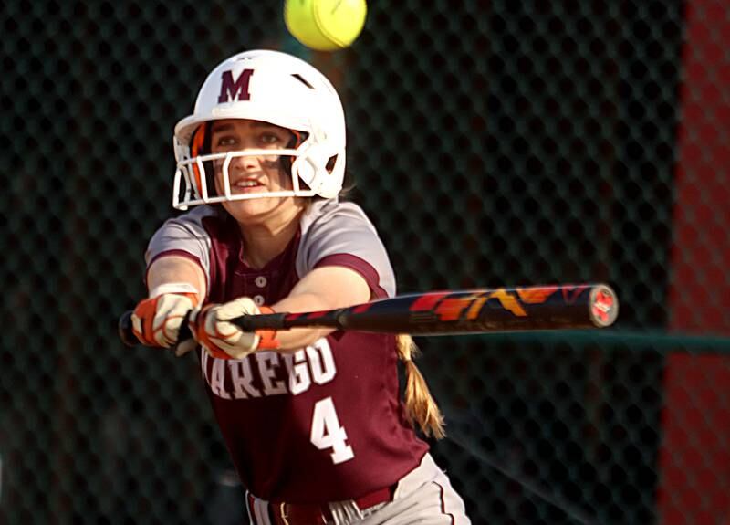 Marengo’s Madeline Christopher slaps the ball against Richmond-Burton in varsity softball at Marengo Wednesday evening.