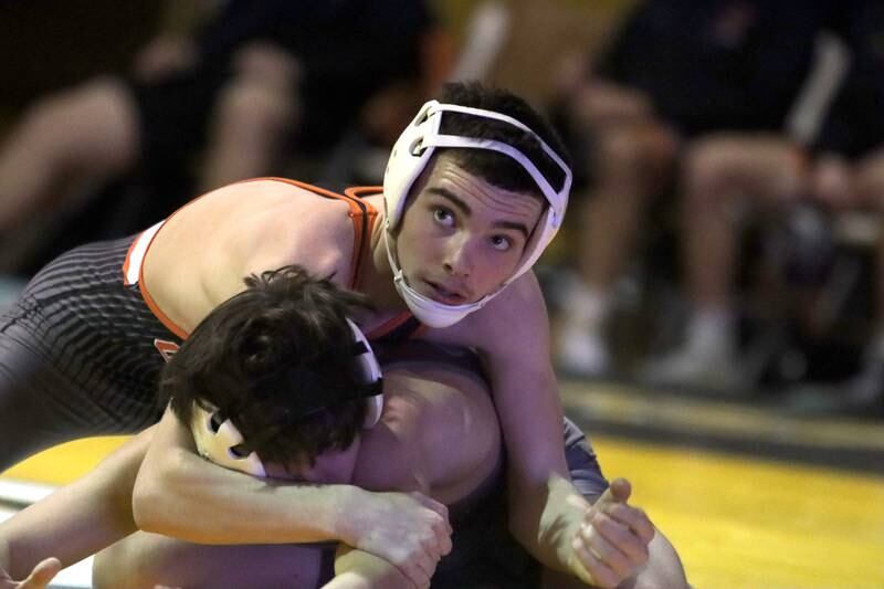 Jacobs’ Anthony Martinez, bottom, battles Crystal Lake Central’s Jackson Marlett at 113 pounds in varsity wrestling on Thursday, Jan. 16, 2025, at Jacobs High School in Algonquin.