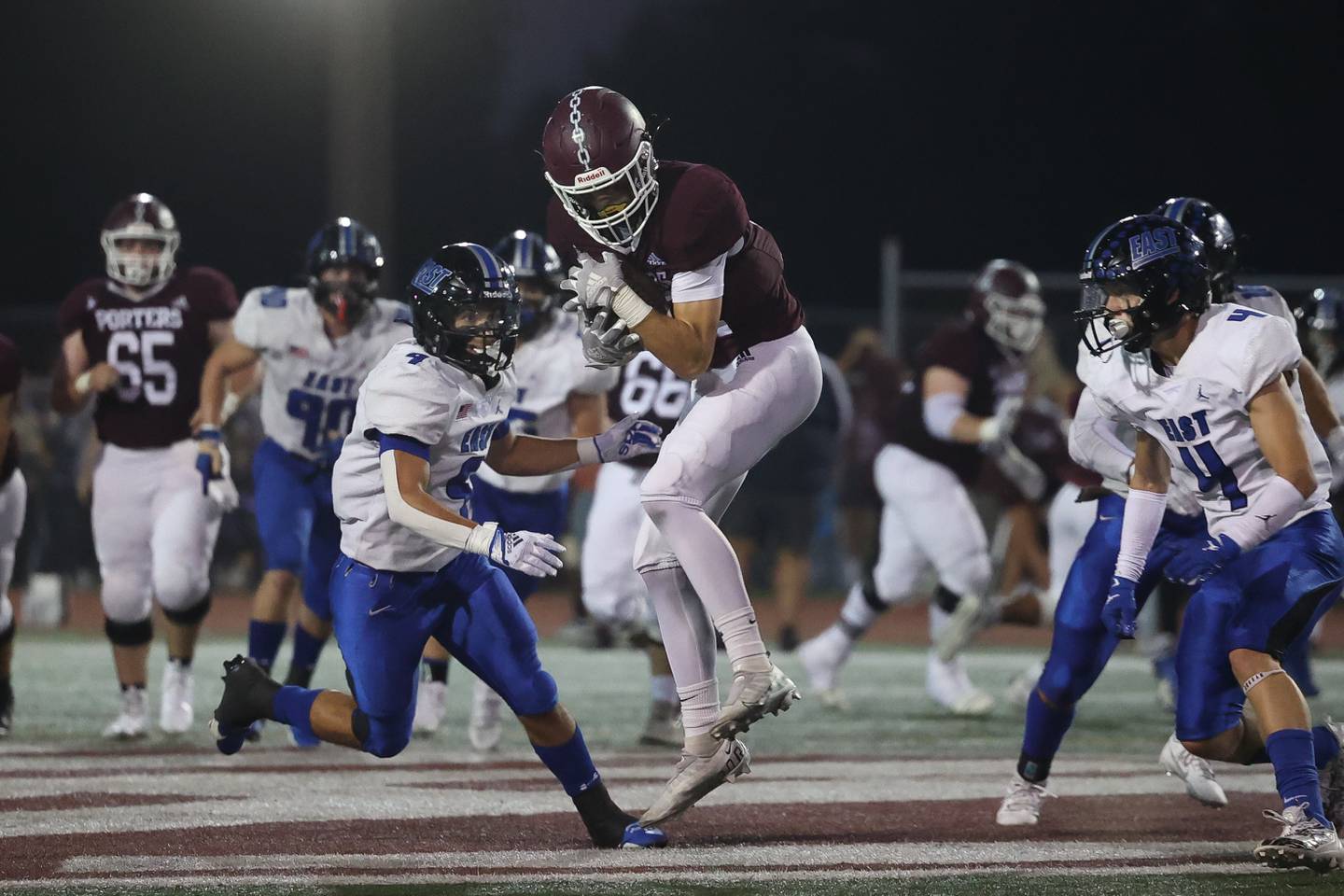 Lockport’s Joshua Ahrens makes a catch for a a first down against Lincoln-Way East on Friday, Sept. 29, 2023 in Lockport.