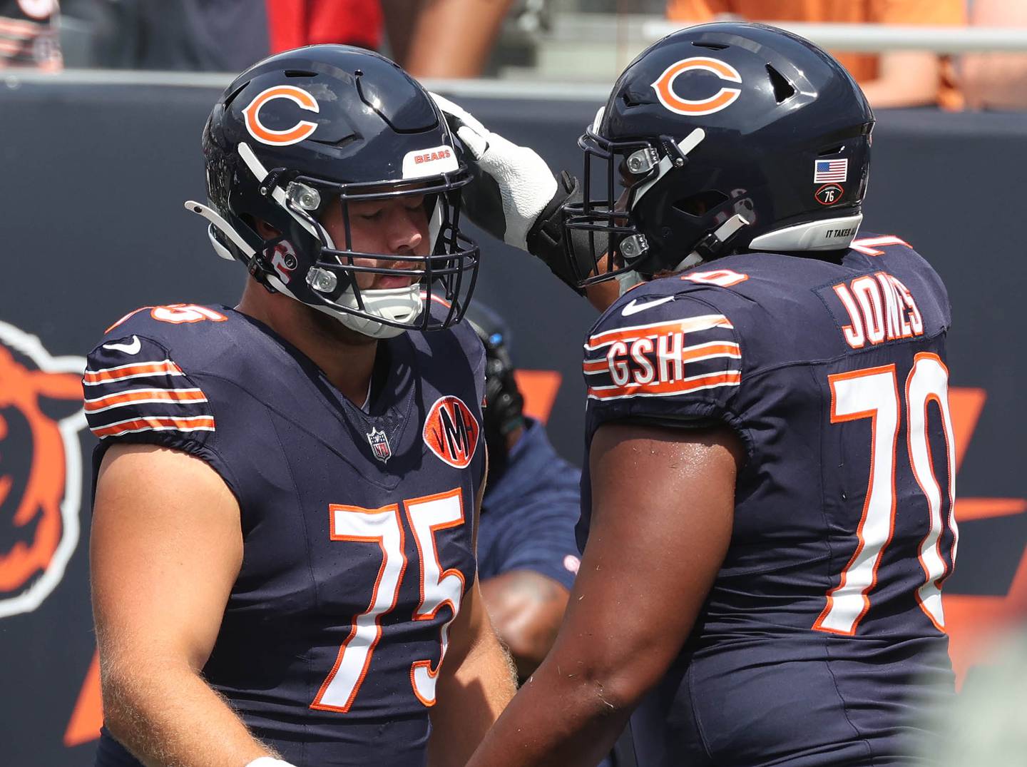 Chicago Bears offensive tackle Ozzy Trapilo (left) and offensive tackle Braxton Jones get together during warmups Sunday, Aug. 10, 2025, before their preseason game against the Miami Dolphins at Soldier Field in Chicago.