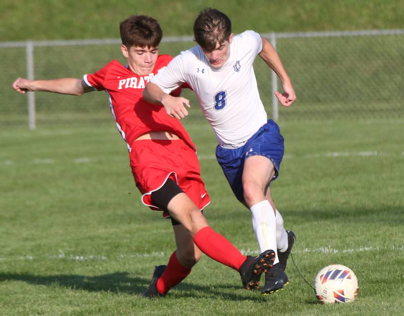 Ottawa's Jordan Arroyo kicks the ball away from Princeton's Chase Sims on Tuesday, Oct. 3, 2023 at Ottawa High School.