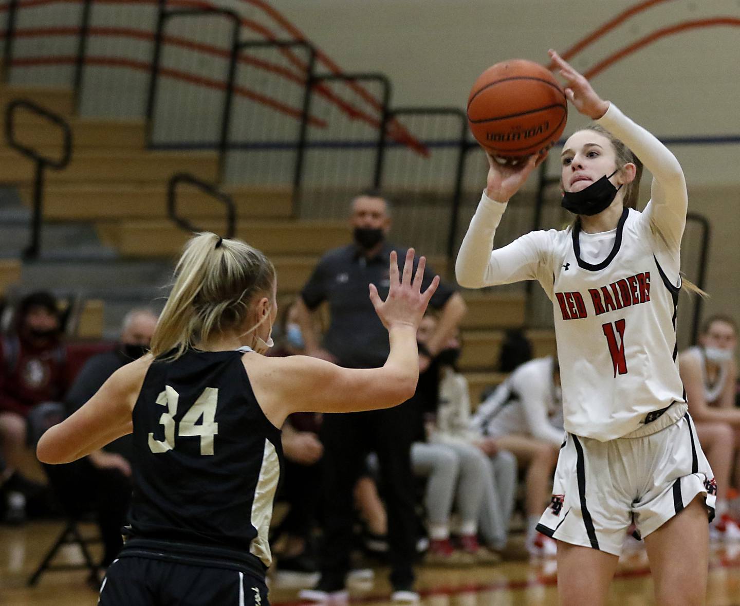 Huntley’s Anna Campanelli shoots over Sycamore’s Reese Hill during a non-conference basketball game Monday evening, Jan. 24, 2022, between Sycamore and Huntley at Huntley High School.