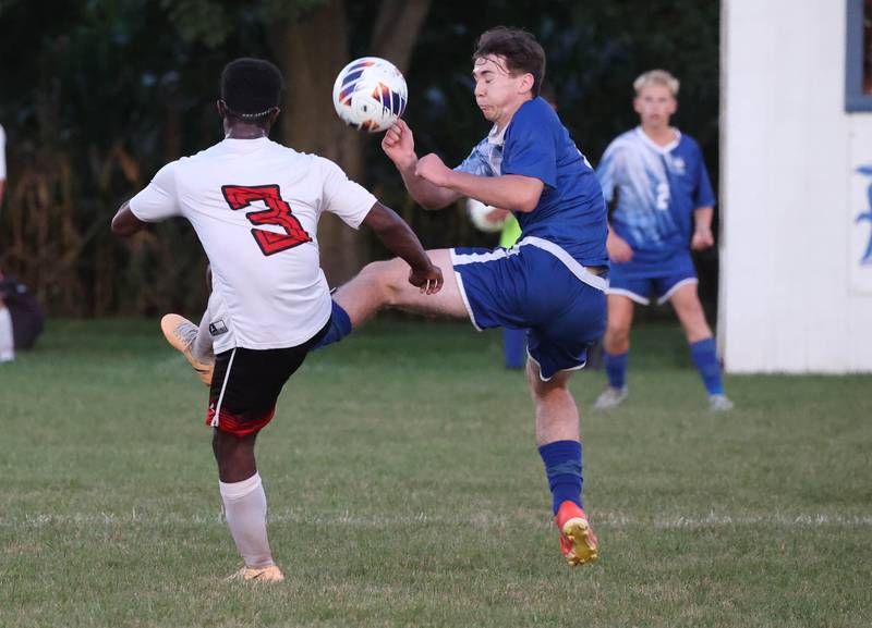 Hinckley-Big Rock's Austin Kennedy (right) and Indian Creek's Cayden Gaston try to control the ball during their game Wednesday, Oct. 2, 2024, at Hinckley-Big Rock High School.