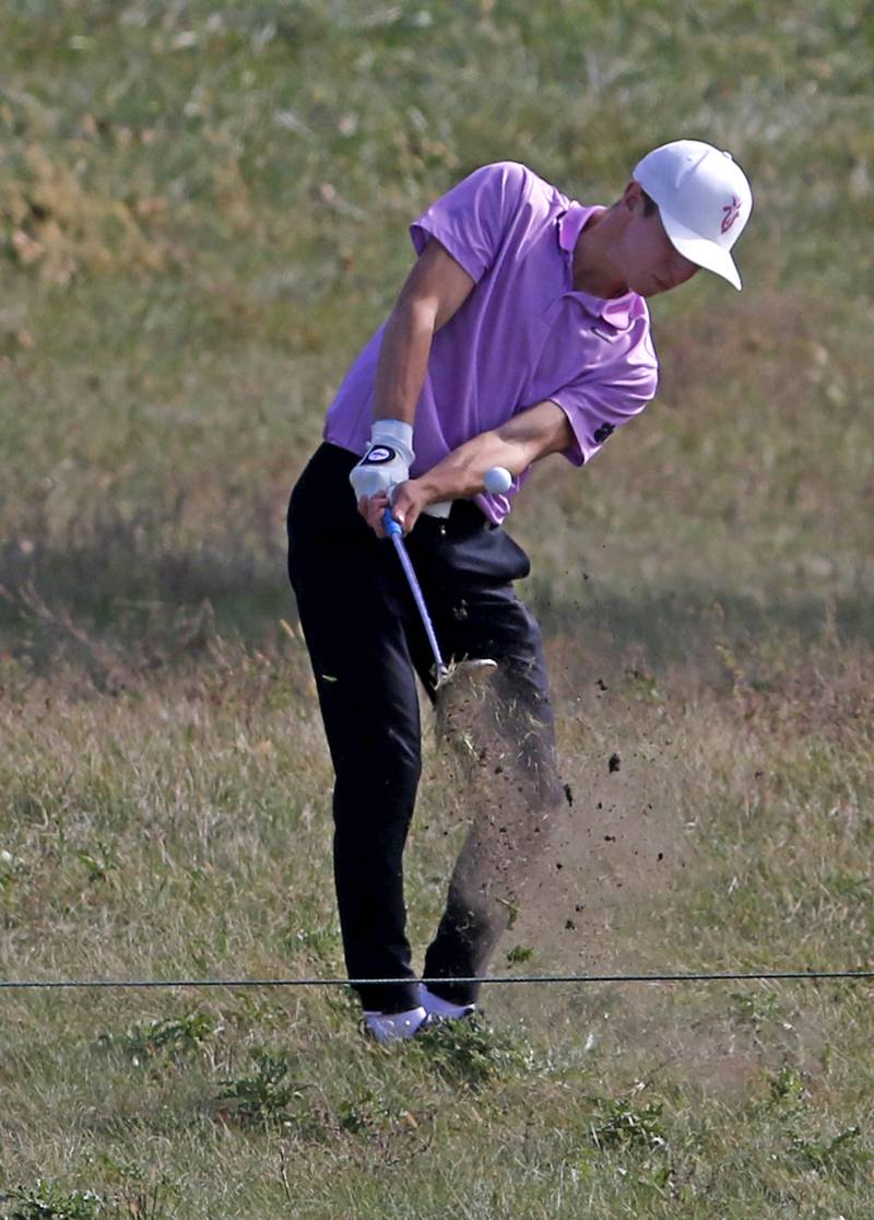 Hampshire’s Nolan Adamczyk hits out of the rough on the seventh hole during the IHSA Class 3A Jacobs Sectional golf tournament on Monday, Oct. 7, 2024, at Randall Oaks Golf Club in West Dundee.