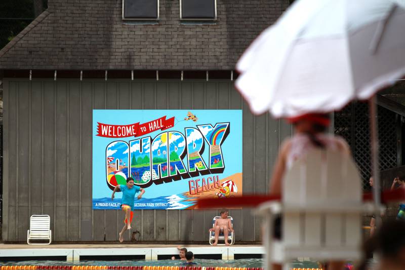 Patrons play in the water at the Batavia Park District’s Hall Quarry Beach on Thursday, June 13, 2024.