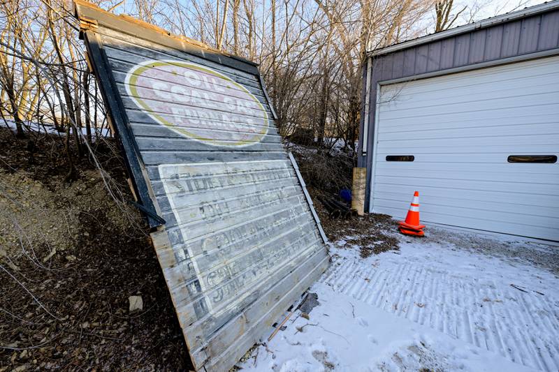 A salvaged wall with painted signage from the historic 1890s Tin Shop building that is being demolished, to make way for a downtown plaza with a public restroom facility and seating, on Wednesday, Jan 21, 2026 in Batavia.