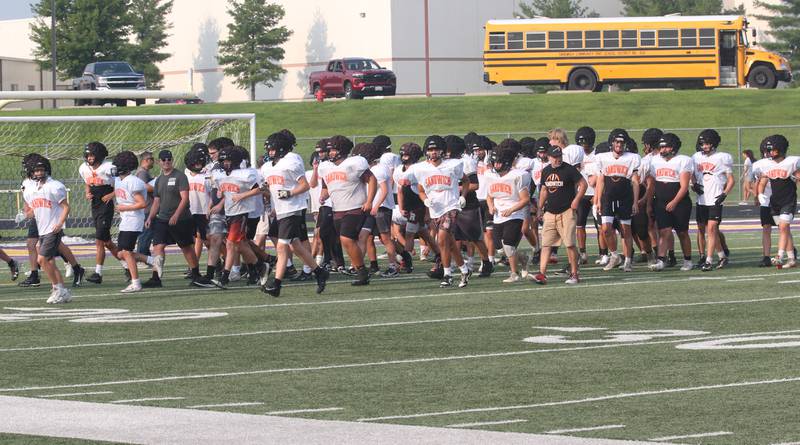 Members of the Sandwich football team take the field during a joint practice on Thursday, July 31, 2025 at Mendota High School.