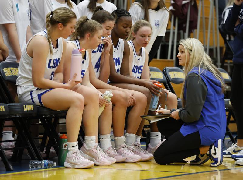 Lyons' head coach Meghan Hutchens talks to the team during a timeout at the girls varsity basketball game between Downers Grove North and Lyons Township on Saturday, Jan. 11, 2025 in La Grange.
