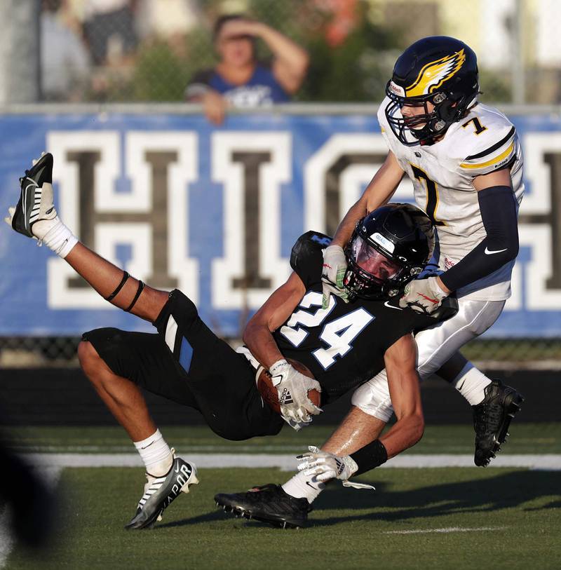 Highland Park's Emmet Pulte (24) pulls in an interception over Leyden's Jacob Sarnecke (7) Friday August 26, 2022 in Highland Park.