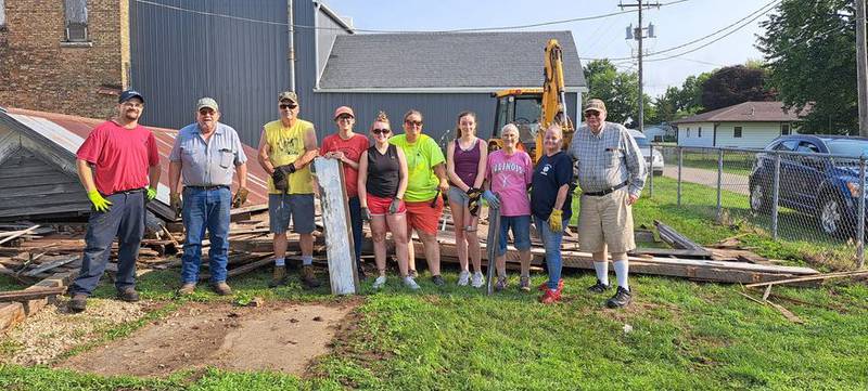 Pictured, left to right, are: Josh Wiederan of D&W Heating and Cooling, Duane Thompson Pres. of the TAHS, Gary Pearson Vice Pres. of the TAHS, Carlee Rizzuto hold the antique board, Melissa Rizzuto, Jenee Blackert, Miss Rizzuto, Sharon Sumner Member of TAHS, EMT Sam Cater Tampico Ambulance, Terry Gaskill Director of TAHS. Absent from the picture were Tyler Chriest Tampico Employee and Bruce Pettier Mayor of Tampico) Picture taken by Joan Johnson Treasurer of the TAHS.
