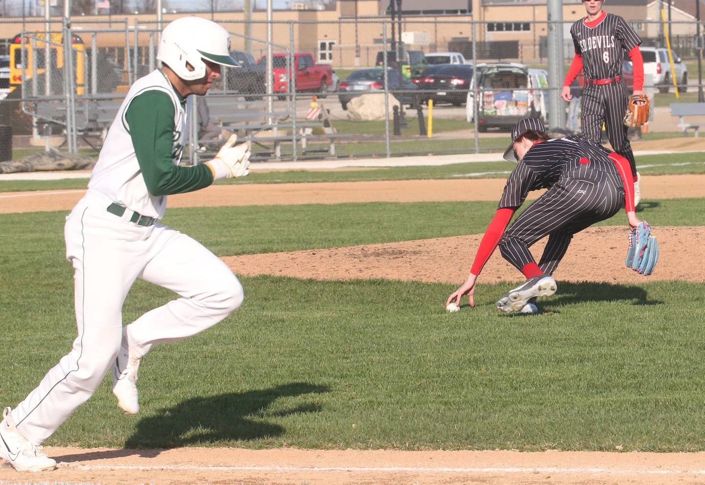 Hall's Izzaq Zrust picks up a ground ball to throw out St. Bede's Ranbir Saini on Monday, March 31, 2025 at Schweickert Stadium in Peru.