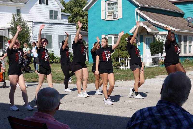 St. Anne High School cheerleaders perform in the Grand Pumpkin Parade during the St. Anne Pumpkin Festival on Saturday, Oct. 4, 2025.