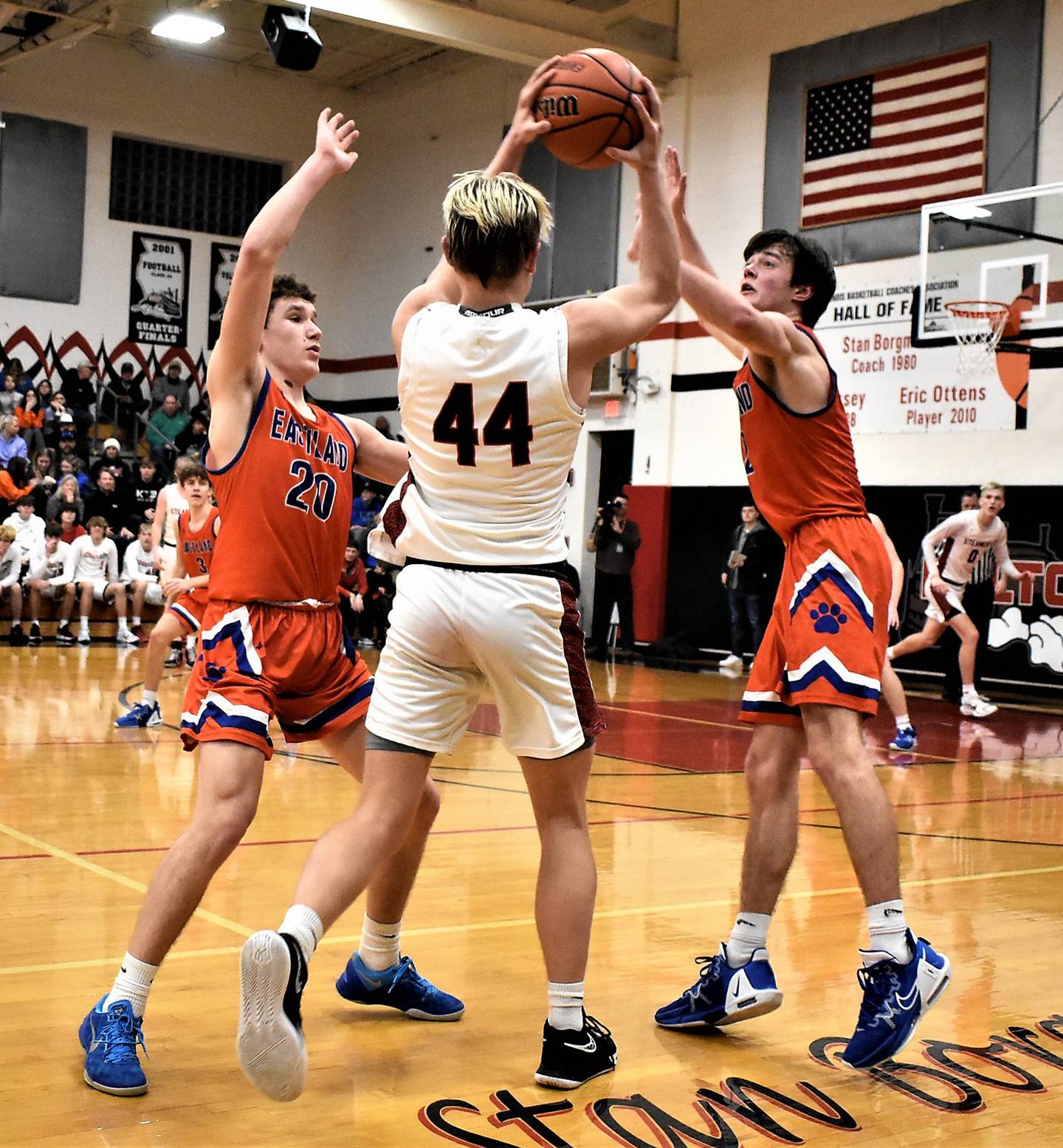 Fulton's Dom Kramer (40) looks to pass as Eastland's Carsen Heeren (2) and Peyton Spears (20) defend during Thursday, Feb. 23 action at the 1A Fulton Regional.