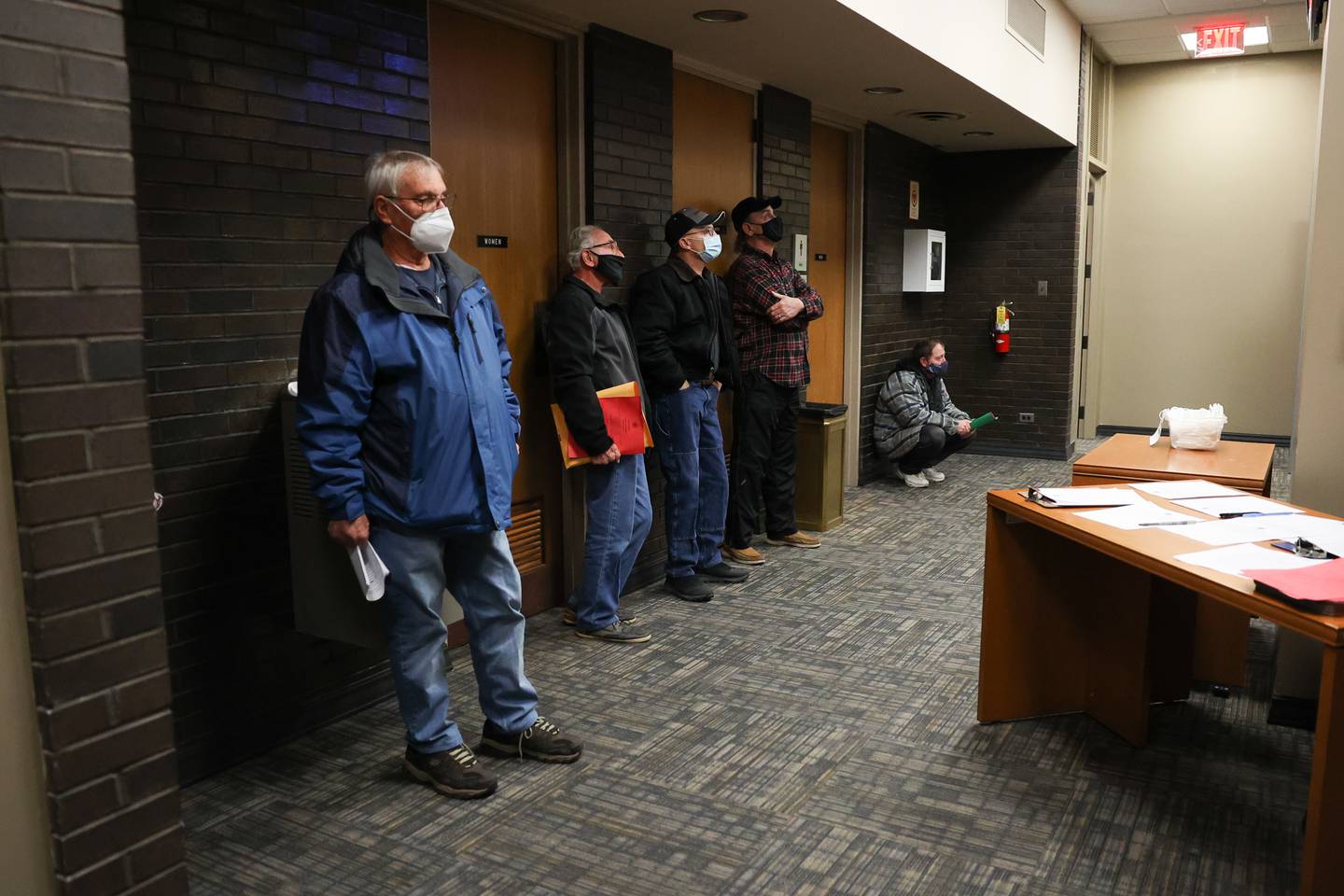 Citizen's stand outside the full council chamber for the NorthPoint hearing on NorthPoint at Joliet City Hall. Tuesday, Dec. 21, 2021 in Joliet.