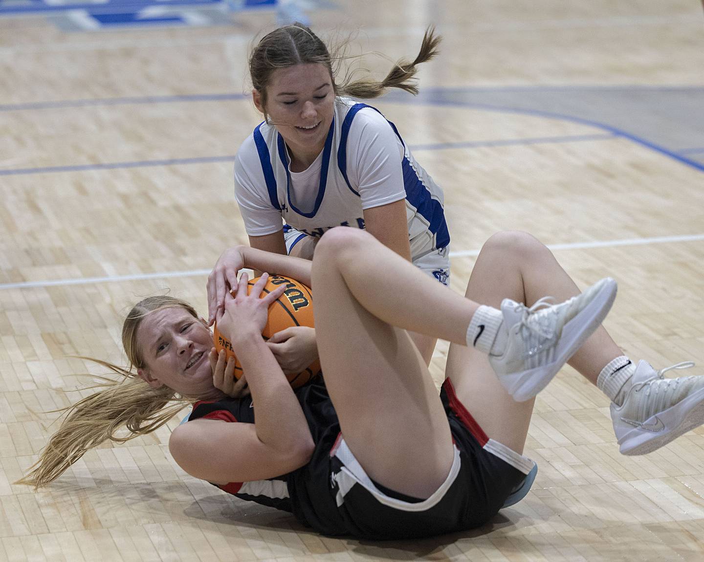 Fulton’s Haley Smither and Newman’s Grace King battle for the ball Tuesday, Nov. 25, 2025.