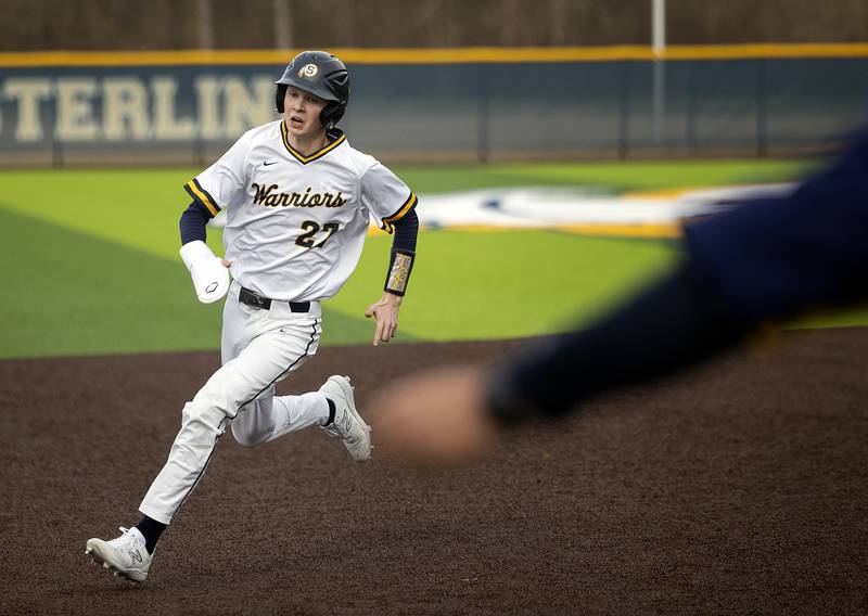 Sterling’s Bryce Hartman rounds third to score against Newman Tuesday, March 18, 2025.