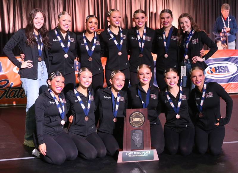 Members of the Morris dance team pose with the Class 1A  IHSA State Dance third-place trophy on Saturday, Feb. 1, 2025 at Grossingers Motor Arena in Bloomington.