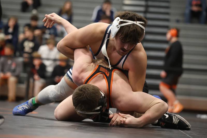 Plainfield South’s Chase Pierceall works over Minooka’s Santino Capodice in the SouthWest Prairie Conference 190 pound championship on Saturday, Jan. 24, 2026 in Minooka.