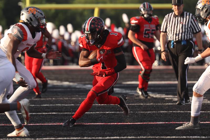 Bolingbrook’s I’Marion Stewart finds room to run after a catch against Minooka. Friday, Aug. 26, 2022, in Bolingbrook.