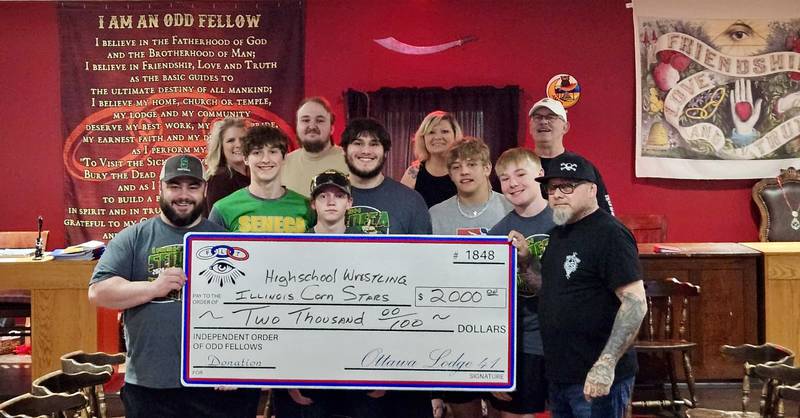 Independent Order of Odd Fellows Ottawa Lodge 41 presented a check for $2,000 to the Illinois Corn Stars high school all-star wrestling team.