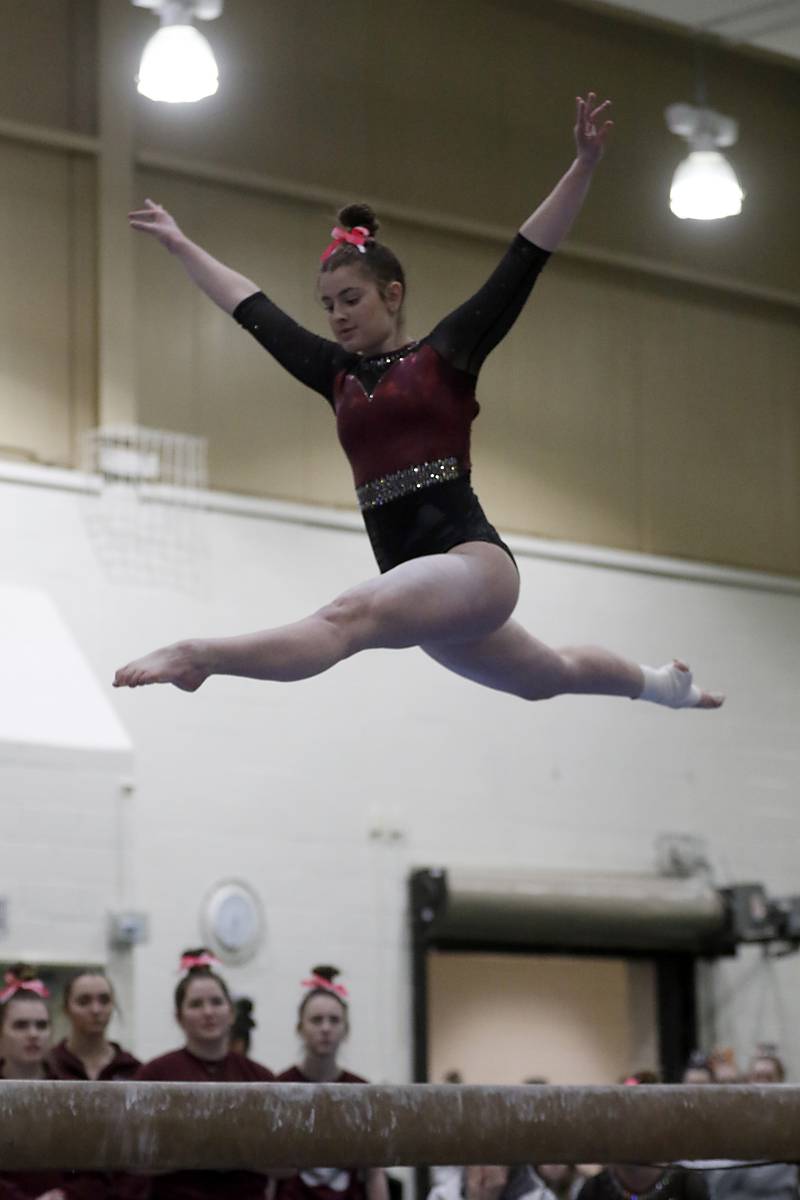 Prairie Ridge’s Delaney Wolfe competes on the balance beam Wednesday, Feb. 8, 2023, during  the IHSA Stevenson Gymnastics Sectional at Stevenson High School in Lincolnshire.