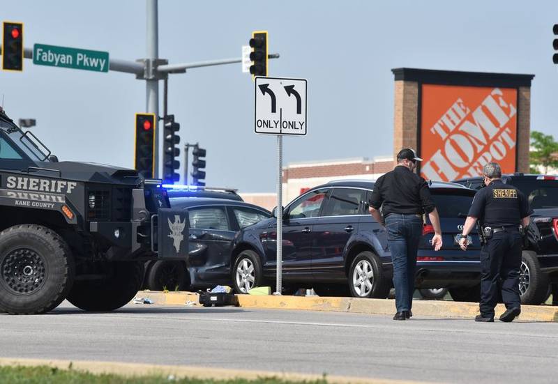 Kane County sheriff's deputies and officers from several other police departments respond to at the intersection of Fabyan Parkway and Randall Road in Geneva. A police chase led to a crash and a reported officer- involved shooting on Wednesday.