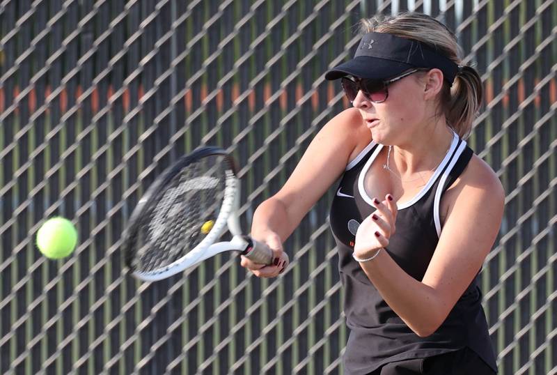 DeKalb’s Nina Christopherson hits a forehand during her match against Sycamore Wednesday, Sept. 13, 2023, at DeKalb High School.