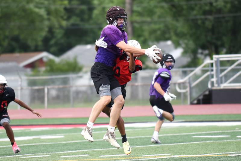 Wilmington's Declan Moran, left, attempts to secure a catch under pressure from Bradley-Bourbonnais' Rontez Smith during a joint summer workout at Bradley-Bourbonnais Wednesday, July 16, 2025.