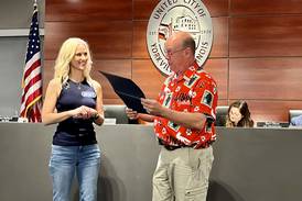 Wheel of Fortune champion honored by Yorkville mayor with certificate of recognition
