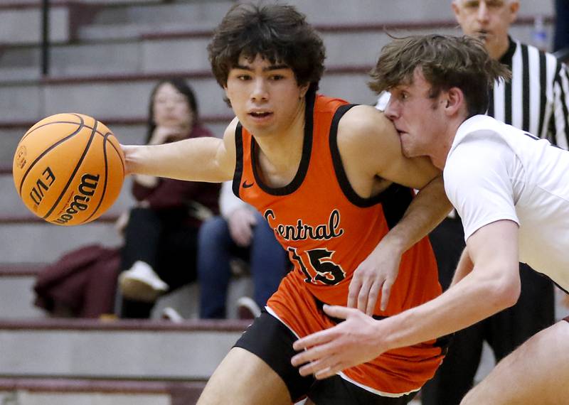 Crystal Lake Central's Mason Alvarez tries to drive against the defense of Prairie Ridge's Rory Rezendes during an IHSA Class 3A Prairie Ridge Regional basketball game on Monday, Feb. 24, 2025, at Prairie Ridge High School.