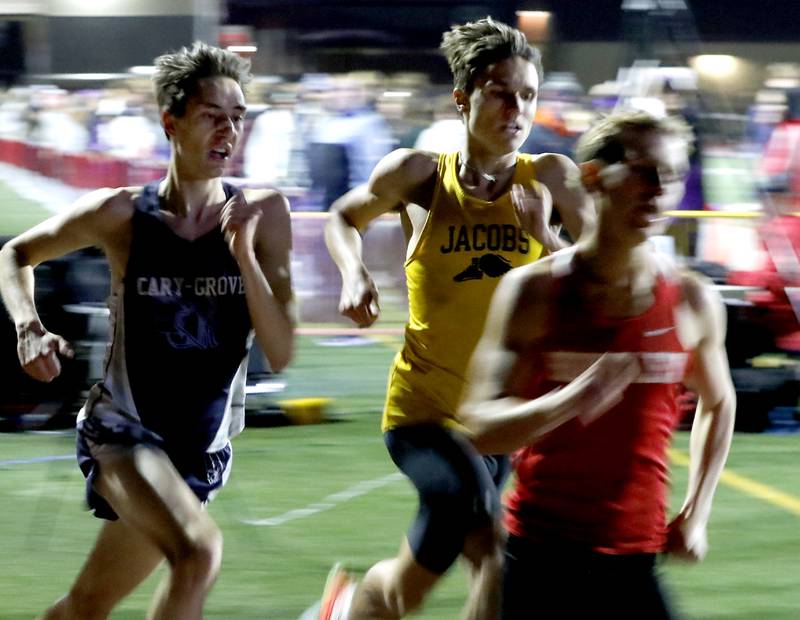 Cary-Grove’s Jameson Tenopir, Jacobs’ Maximilian Sudrzynski and Huntley’s Tommy Nitz compete in the 1600 meter run during the Huntley IHSA Class 3A Boys Sectional Track and Field Meet on Thursday, May 22, 2025, at Huntley High School.