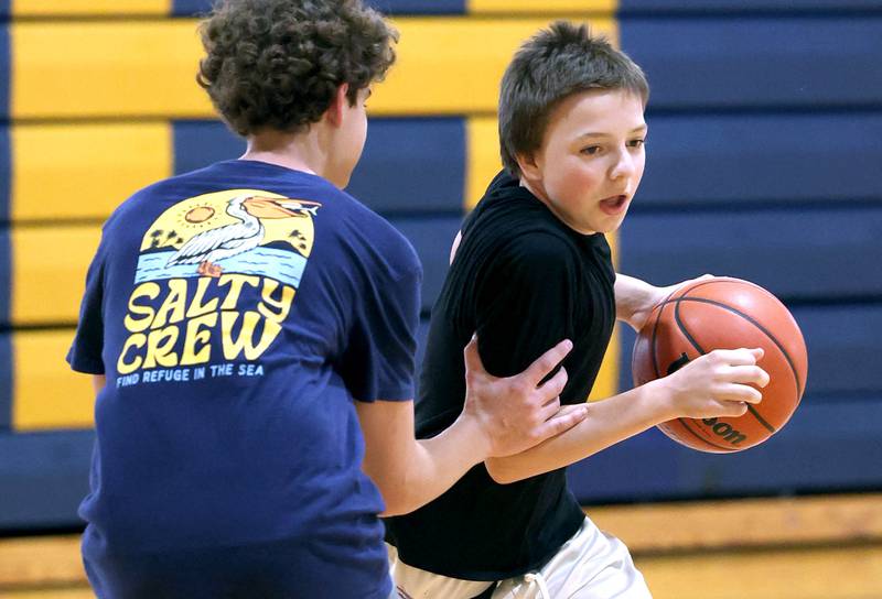 Hiawatha’s Caiden Wiegartz tries to get around teammate Jackson Davenport during practice Thursday, June 13, 2024 at the school in Kirkland.
