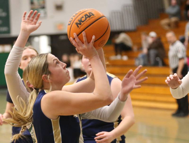Marquette's Chloe Thrush eyes the hoop against Midland on Thursday, Feb. 12, 2026 at Midland High School.