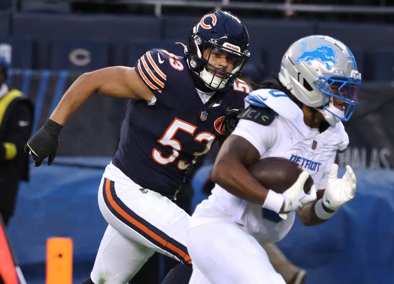 Chicago Bears linebacker T.J. Edwards loses the footrace as Detroit Lions running back Jahmyr Gibbs scores a touchdown during their game Sunday, Jan. 4, 2026, at Soldier Field in Chicago.