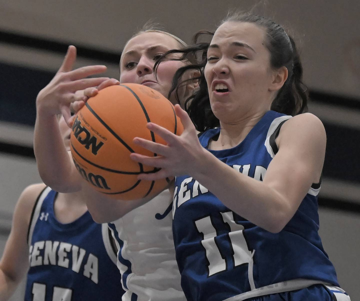 Geneva’s Heidi Clesen battles St. Charles North’s Brianna Buono for the ball in a girls basketball game in St. Charles on Thursday, Jan. 22, 2026.