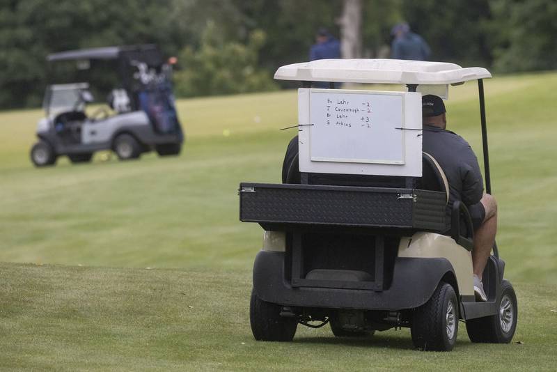 A traveling leaderboard followed the top players around logging the current round scores during the Pine Hills Golf Tournament on Sunday, June 11, 2023 in Ottawa.