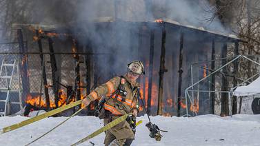 Dixon firefighters battle shed fire