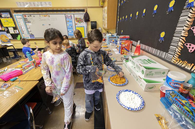 Noah Markel, first grader at Washington School in Dixon, selects treats for the 100 days of class recognition on Thursday, Jan. 26, 2023.