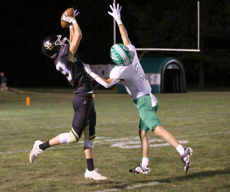 St. Bede's Hunter Savage leaps to make a catch over Ridgewood's Lucas Melendez on Friday, Sept. 15, 2023 at St. Bede Academy.