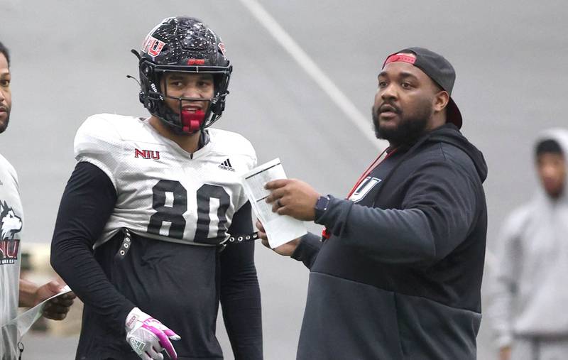 Northern Illinois University tight end Miles Joiner talks to one of his coaches during spring practice Wednesday, April 6, 2022, in the Chessick Practice Center at NIU in DeKalb.