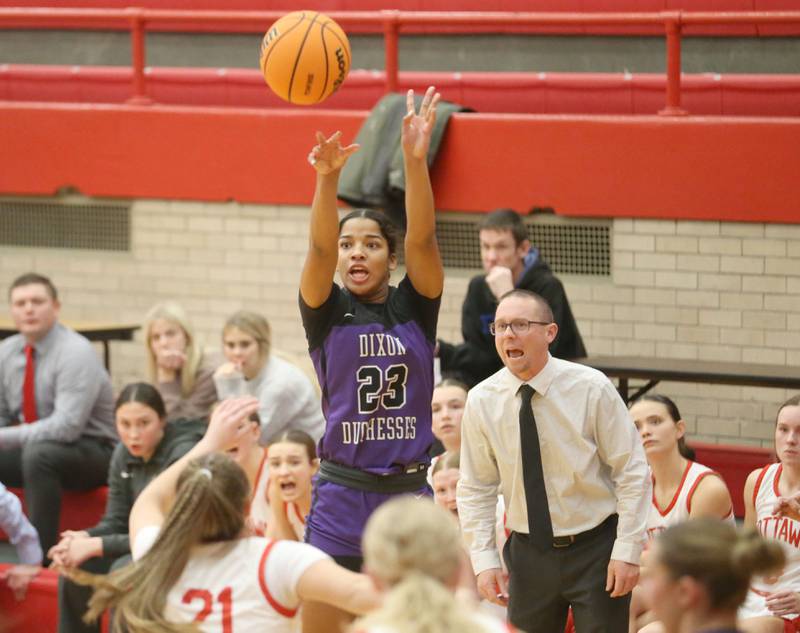 Dixon's Ahmyrie McGowan shoots a jump shot over Ottawa's Hailey Thrush on Wednesday, Dec. 3, 2025 in Kingman Gymnasium at Ottawa High School.