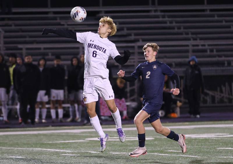 Mendota's Danny Garcia gets in front of Quincy Notre Dame's Matthew Many to knock down the ball during the Class 1A Supersectional game on Monday, Nov. 3, 2025 at Mendota High School.