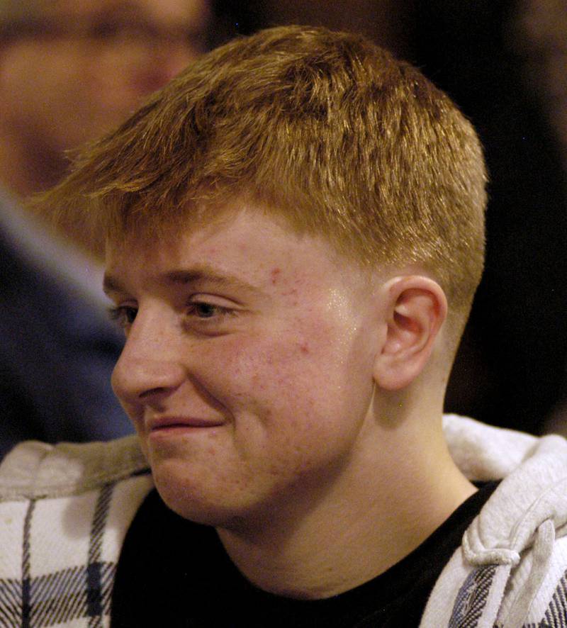 Dylan Wescott smiles as he talks with visitors at his Welcome Home party at Emerson's Pub on Saturday, Nov. 22.