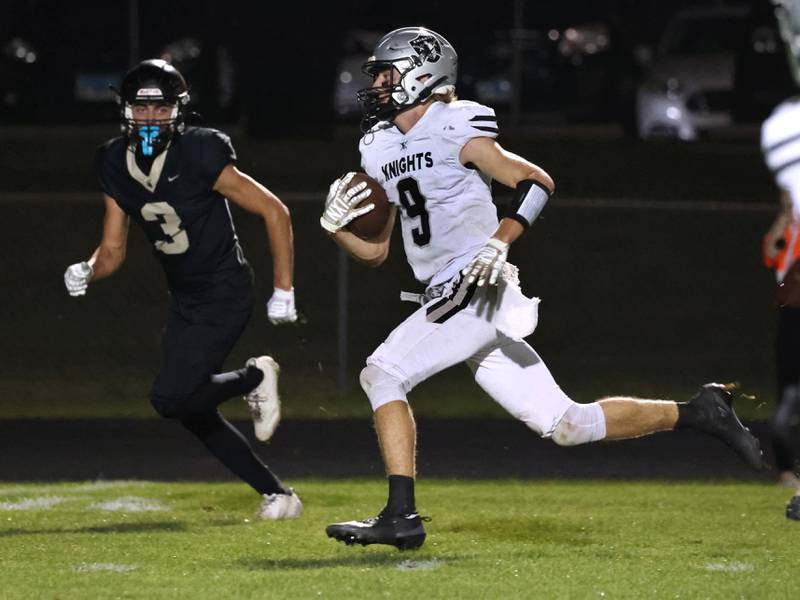 Kaneland's Carter Grabowski outruns Sycamore's Benjamin Anderson for a touchdown during their game Friday, Oct. 3, 2025, at Sycamore High School.