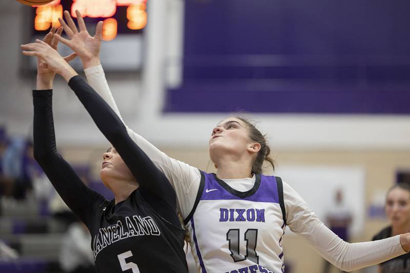 Dixon’s Kiley Gaither and Kaneland’s Sophia Rosati reach for a ball Wednesday, Dec. 10, 2025.