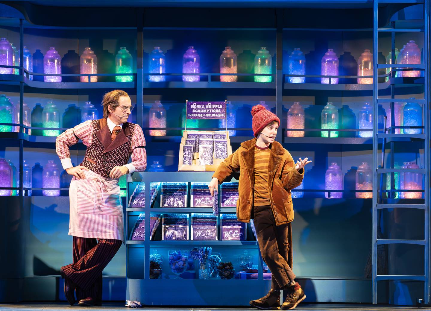 Stephen Schellhardt (left) plays Willy Wonka and Charlie Long is Charlie Bucket in Paramount Theatre’s Professional Regional Premiere of Charlie and the Chocolate Factory. Performances are November 8, 2023-January 14, 2024. Trent Stork directs. For tickets and information, visit paramountaurora.com, or call (630) 896-6666. Note: Charlie Long alternates performances as Charlie Bucket with Meena Sood. Photo credit: Amy Nelson